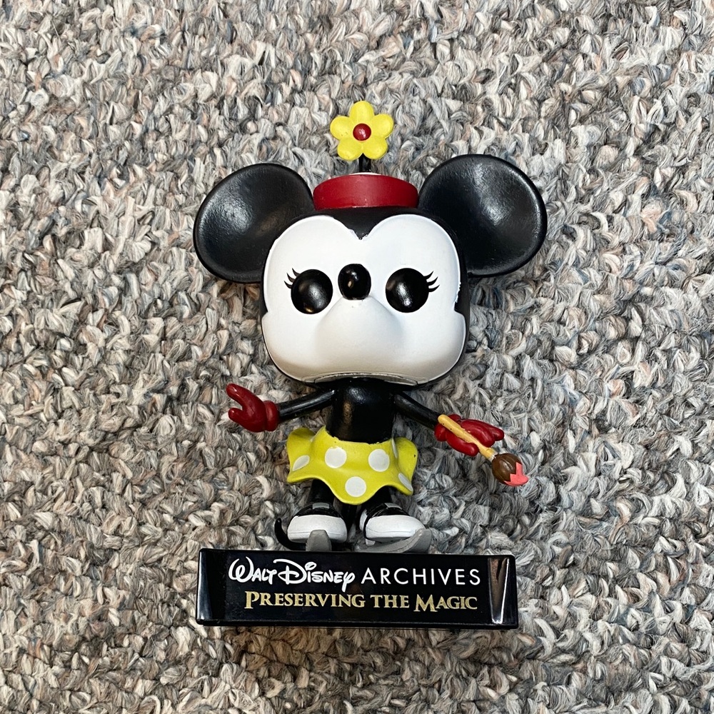 Disney Minnie Mouse Collectible with Red and Yellow Accents